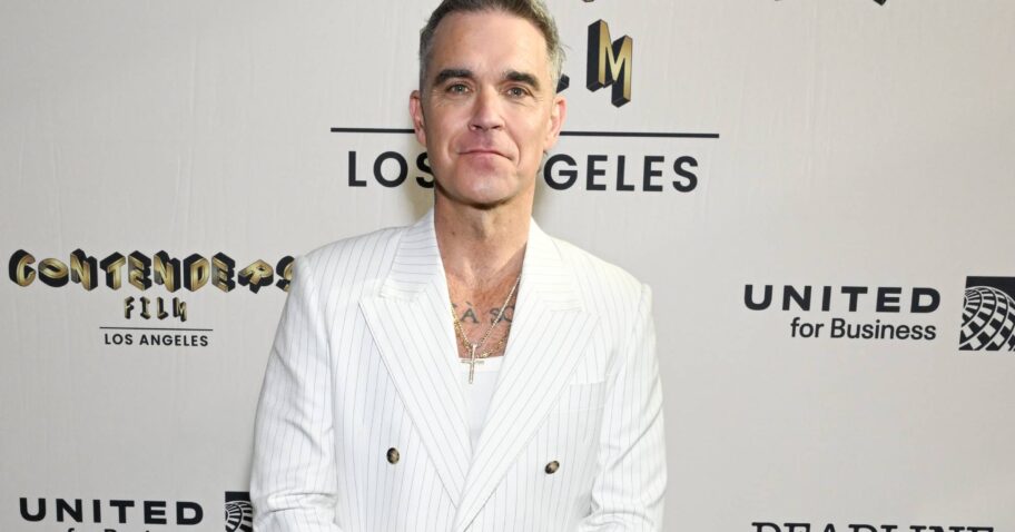 Robbie Williams hits out at ex-Take That supervisor over drug use claims in boyband documentary img